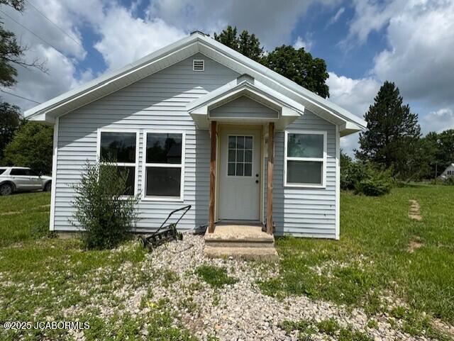 210 Academy St, Clarksburg, MO 65025 - bungalow-style home featuring a front yard