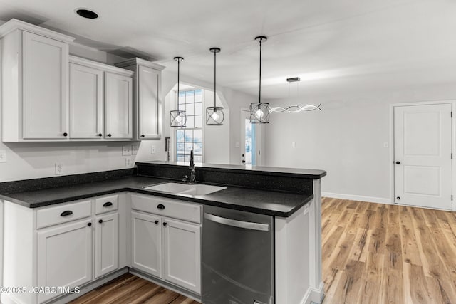 600 Peterson Ln, Ashland, MO 65010 - kitchen with dishwasher, dark countertops, a peninsula, white cabinets, and pendant lighting