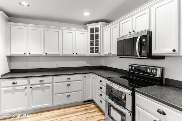 600 Peterson Ln, Ashland, MO 65010 - kitchen with appliances with stainless steel finishes, white cabinetry, recessed lighting, and dark countertops