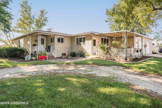 view of front of property with a garage and a front yard