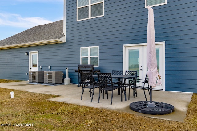 back of house featuring a patio area and central air condition unit