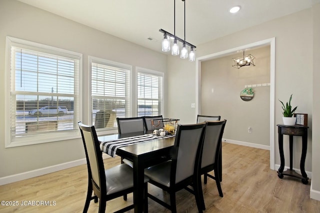 dining room with light hardwood / wood-style floors