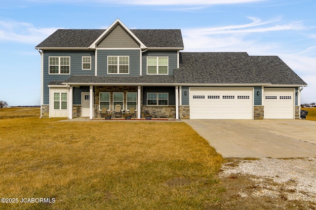 craftsman-style house with a porch, a garage, and a front lawn