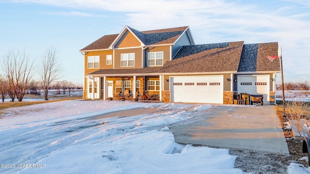 view of front of property with a porch and a garage