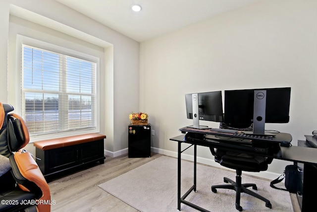 office area with light hardwood / wood-style flooring