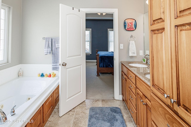 2414 Camzie Dr, Jefferson City, MO 65101 - bathroom with a sink, a whirlpool tub, double vanity, and connected bathroom