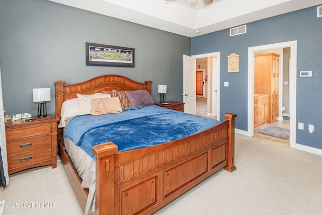 2414 Camzie Dr, Jefferson City, MO 65101 - bedroom featuring visible vents, baseboards, ensuite bathroom, and light colored carpet