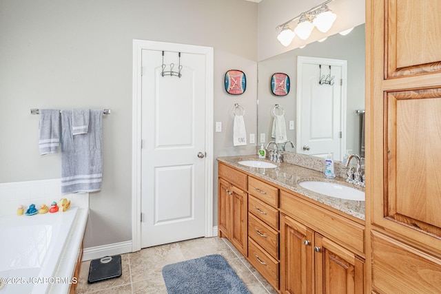 2414 Camzie Dr, Jefferson City, MO 65101 - full bath featuring a sink, double vanity, tile patterned flooring, and a garden tub
