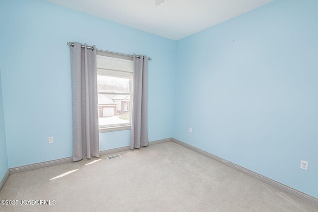 2414 Camzie Dr, Jefferson City, MO 65101 - carpeted empty room with visible vents and baseboards