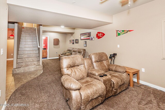 2414 Camzie Dr, Jefferson City, MO 65101 - carpeted living room featuring baseboards, a ceiling fan, and stairs