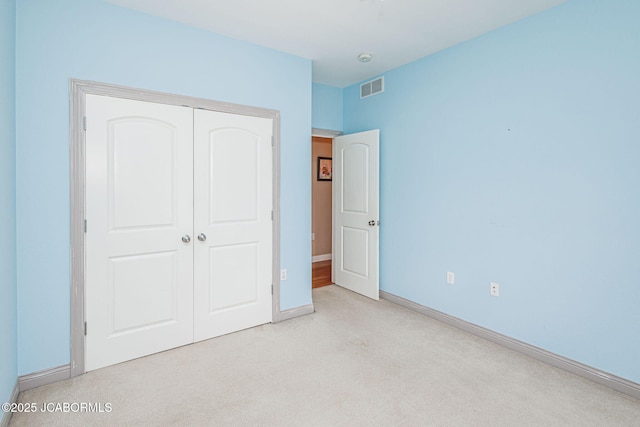 2414 Camzie Dr, Jefferson City, MO 65101 - unfurnished bedroom featuring light carpet, visible vents, a closet, and baseboards