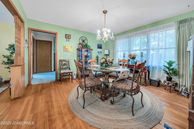 409 Lorene St, California, MO 65018 - dining area with a chandelier and light wood finished floors