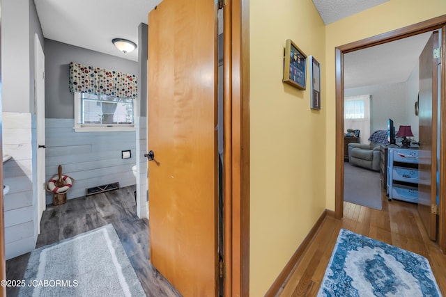409 Lorene St, California, MO 65018 - hallway featuring wood finished floors and a wainscoted wall