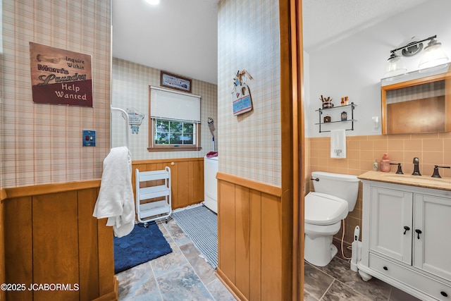 409 Lorene St, California, MO 65018 - bathroom featuring vanity, wallpapered walls, and wainscoting