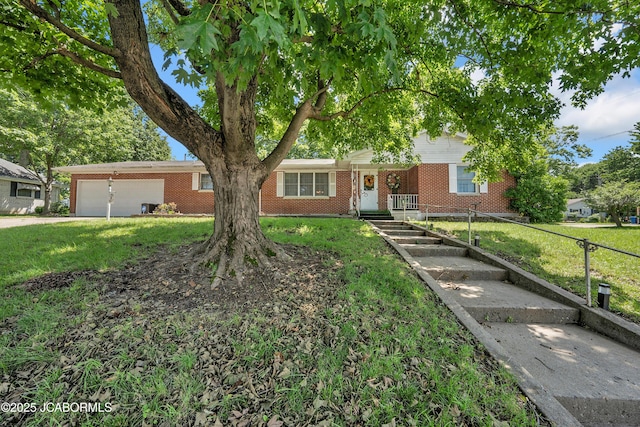 409 Lorene St, California, MO 65018 - view of front facade featuring brick siding, a garage, and a front yard