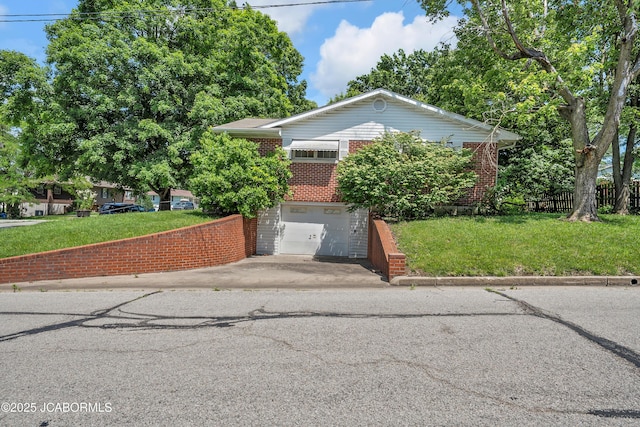 409 Lorene St, California, MO 65018 - obstructed view of property featuring brick siding, asphalt driveway, and a garage