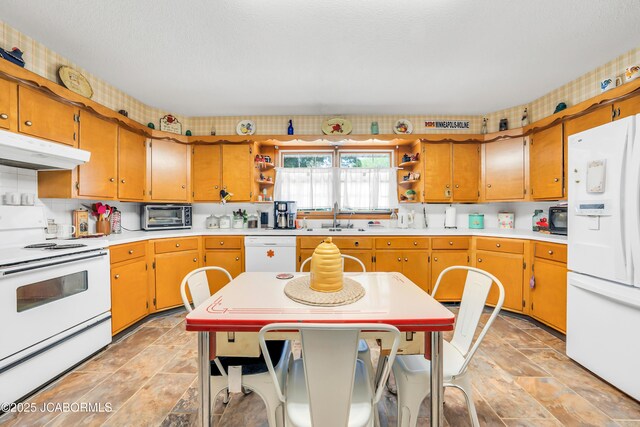 409 Lorene St, California, MO 65018 - kitchen featuring white appliances, under cabinet range hood, open shelves, light countertops, and light stone finish flooring