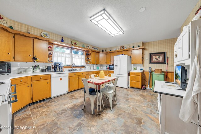 409 Lorene St, California, MO 65018 - kitchen with white appliances, open shelves, light countertops, light stone finish flooring, and a textured ceiling