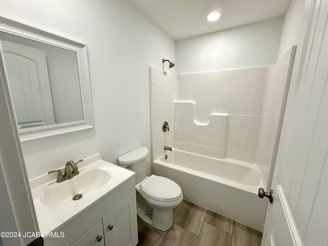 full bathroom featuring shower / bathing tub combination, vanity, and toilet