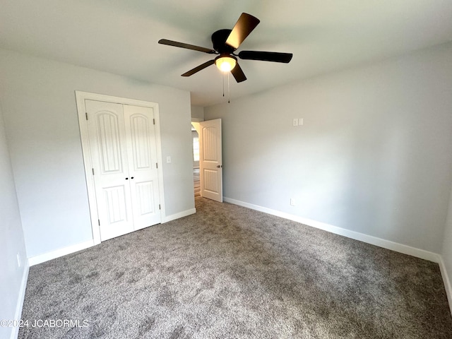 unfurnished bedroom featuring carpet flooring, a closet, and ceiling fan