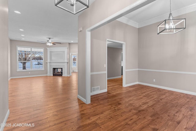 unfurnished living room featuring hardwood / wood-style floors and ceiling fan