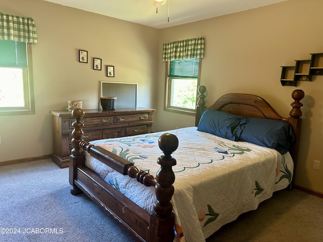 carpeted bedroom featuring baseboards