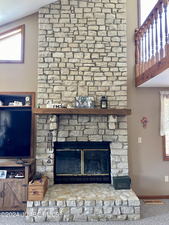 145 W Cedar Tree Ln, Hartsburg, MO 65039 - living area with plenty of natural light, a ceiling fan, a large fireplace, rail lighting, and light carpet