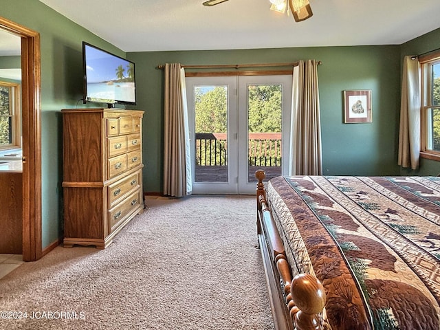 unfurnished bedroom featuring access to outside, ceiling fan, and carpet