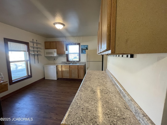 kitchen featuring white appliances, dark hardwood / wood-style floors, and sink