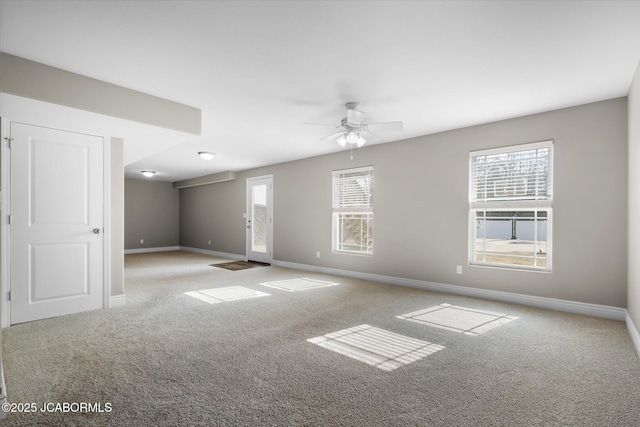 carpeted empty room with ceiling fan