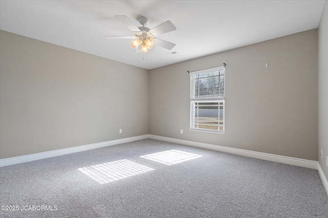 spare room featuring ceiling fan and carpet flooring