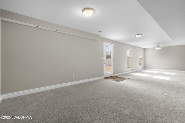 carpeted empty room featuring ceiling fan