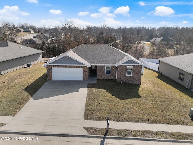 view of front of house with a garage and a front lawn