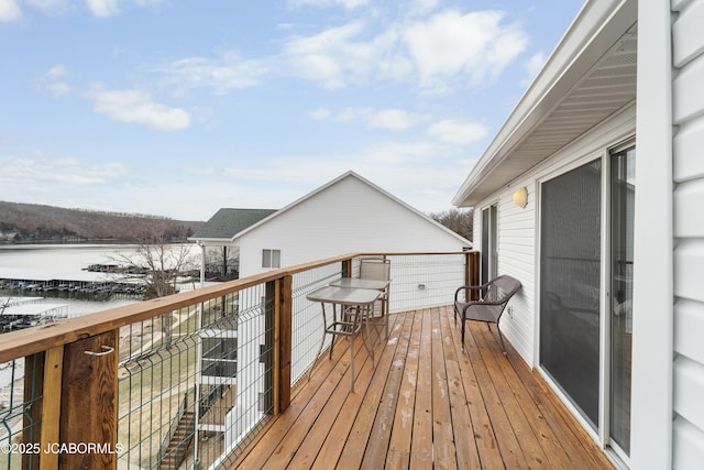 wooden deck with a water view