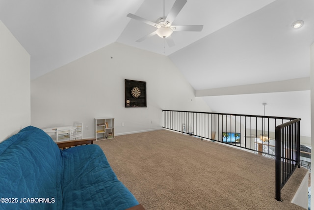 sitting room featuring lofted ceiling, ceiling fan, baseboards, and carpet flooring