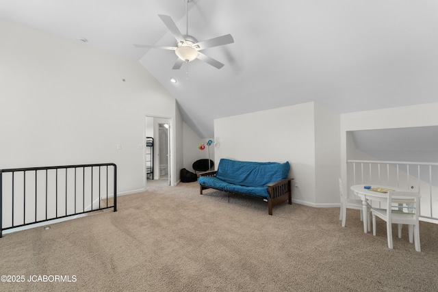 living area featuring lofted ceiling, carpet floors, a ceiling fan, and baseboards