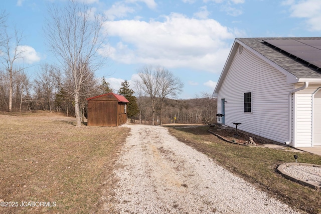 view of road featuring gravel driveway