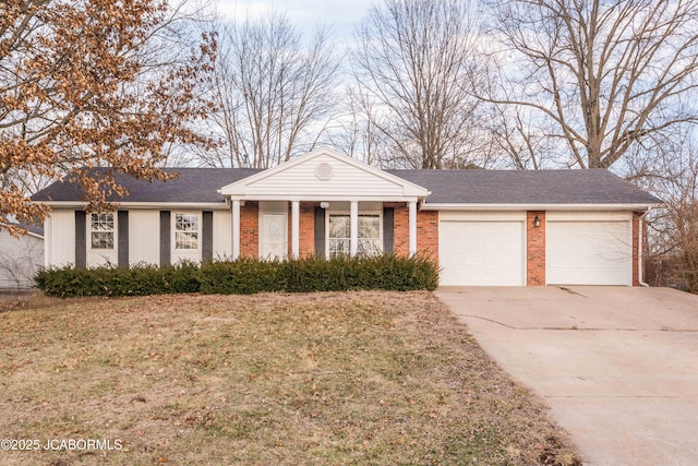 view of front facade featuring brick siding, a shingled roof, concrete driveway, a front yard, and a garage