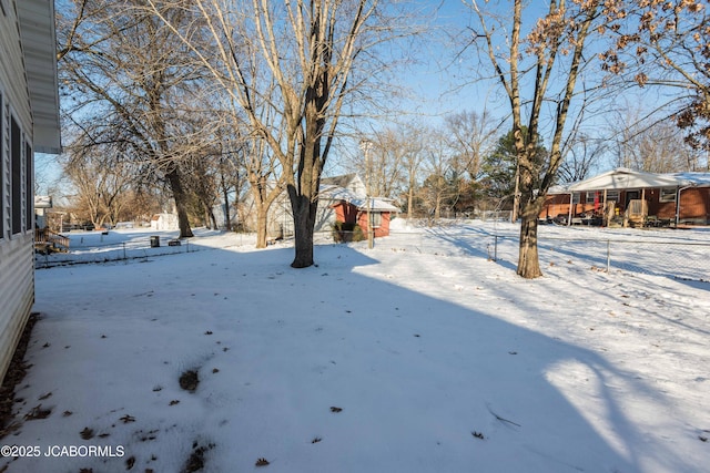 view of yard covered in snow