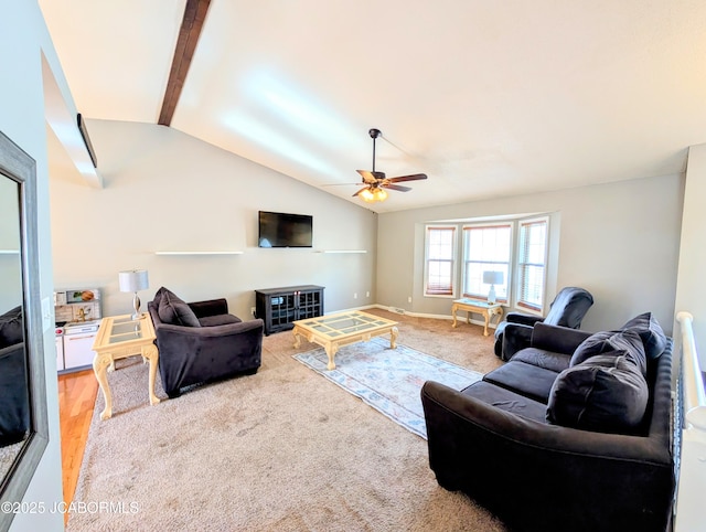 living room with carpet floors, vaulted ceiling, and ceiling fan