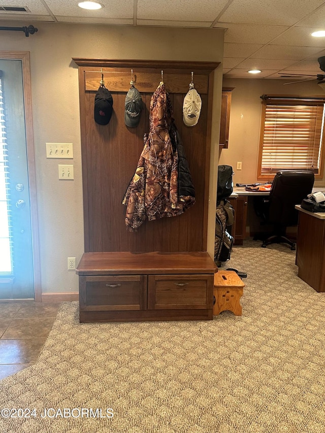 mudroom featuring a paneled ceiling, carpet floors, and ceiling fan