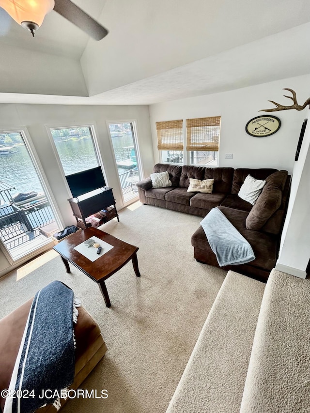 living room with lofted ceiling and carpet flooring