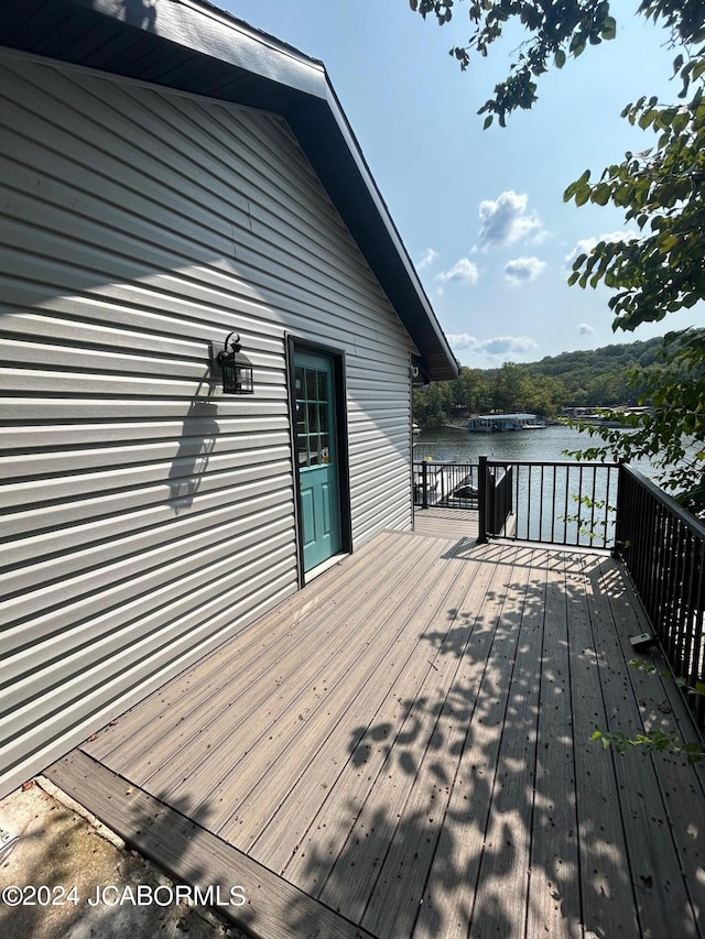 deck featuring a water view