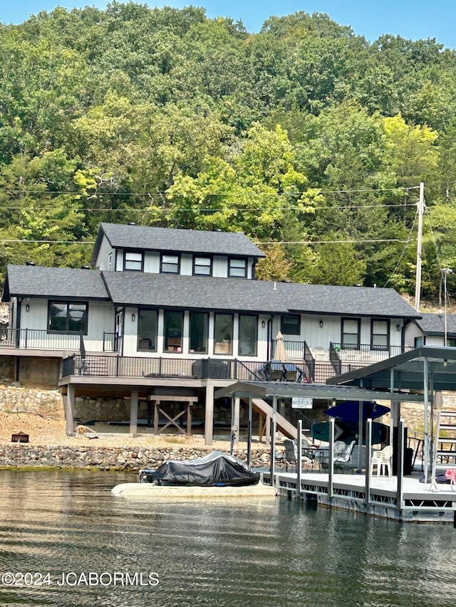 dock area with a deck with water view