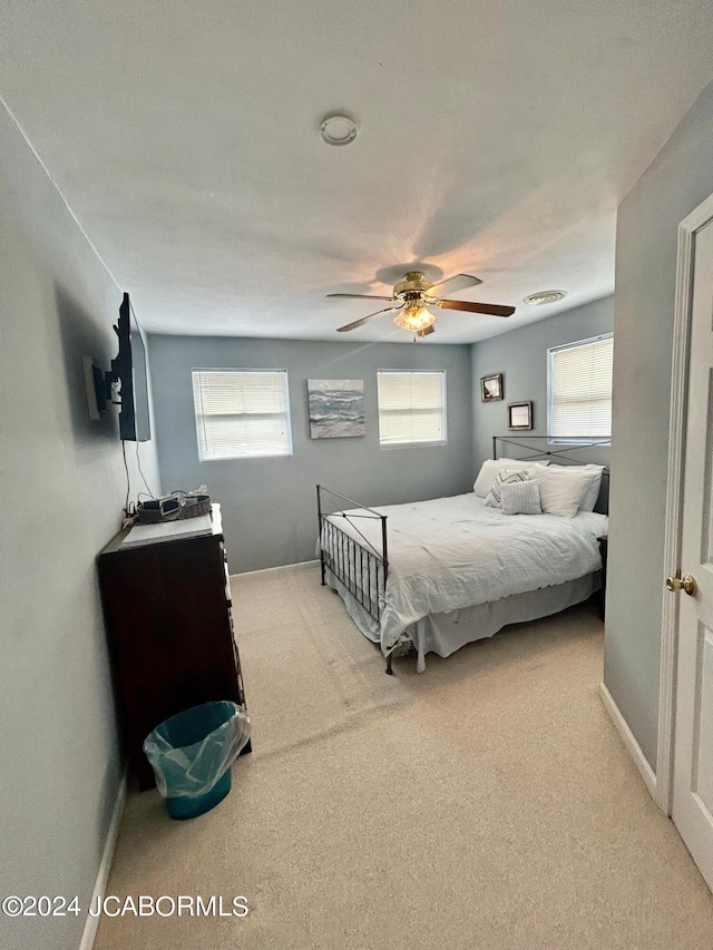 bedroom featuring ceiling fan and carpet floors