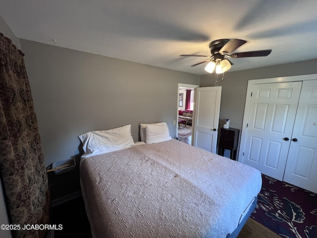 bedroom featuring ceiling fan and a closet