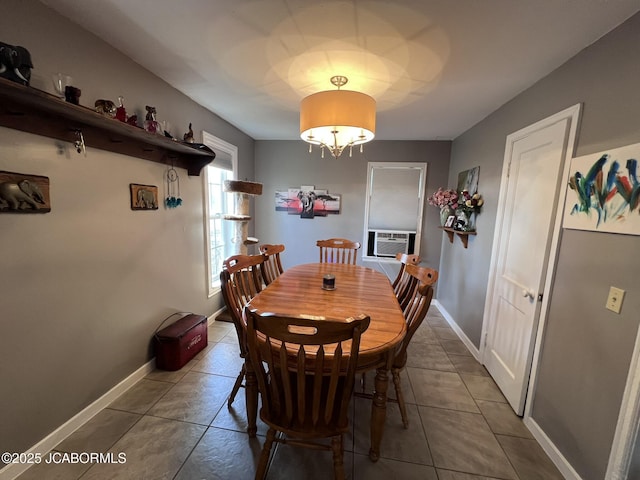 tiled dining area with baseboards and cooling unit