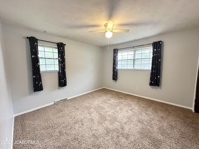 2412 Scenic Dr, Jefferson City, MO 65101 - carpeted spare room featuring healthy amount of natural light and ceiling fan