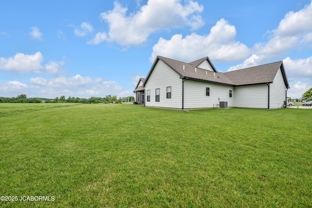 1308 Haxby Ct, Columbia, MO 65201 - rear view of house with a lawn, central air condition unit, and a shingled roof