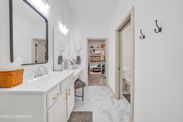 1308 Haxby Ct, Columbia, MO 65201 - full bathroom featuring marble look tiles, vanity, and toilet